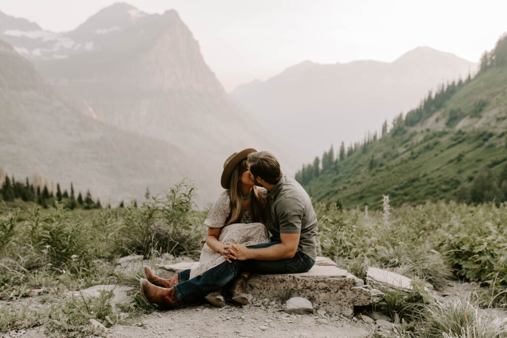 Glacier National Park Big Bend Engagement Photos couple kissing on rock