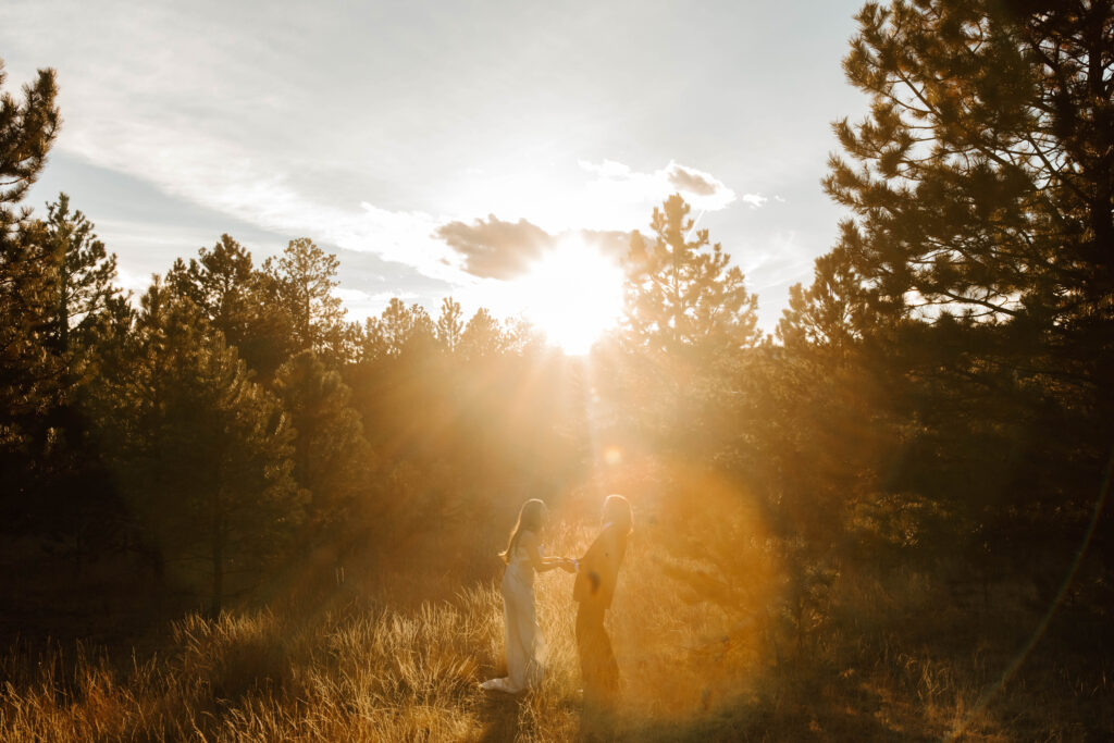 golden hour bridal portraits in the Colorado mountains, couple laughs