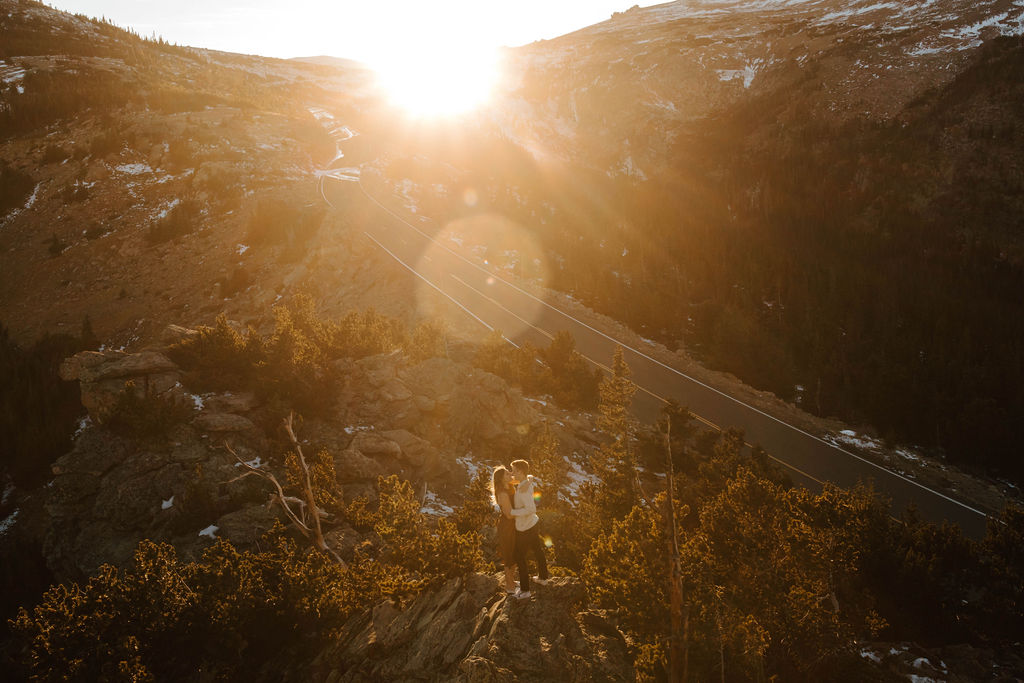 couple dances on top of a mountain