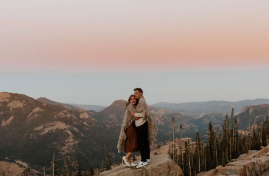 couple is enveloped by pink skies