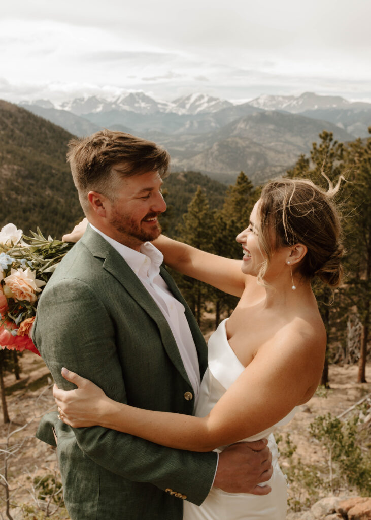 bride and groom laugh together in a candid moment
