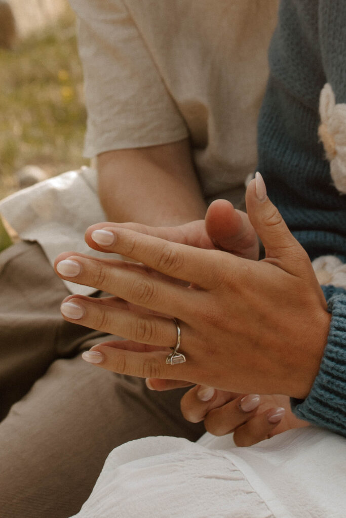 couple holds hands together