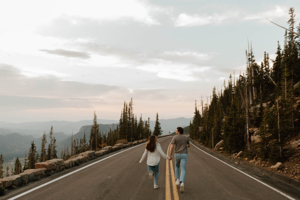 couple runs down mountain road