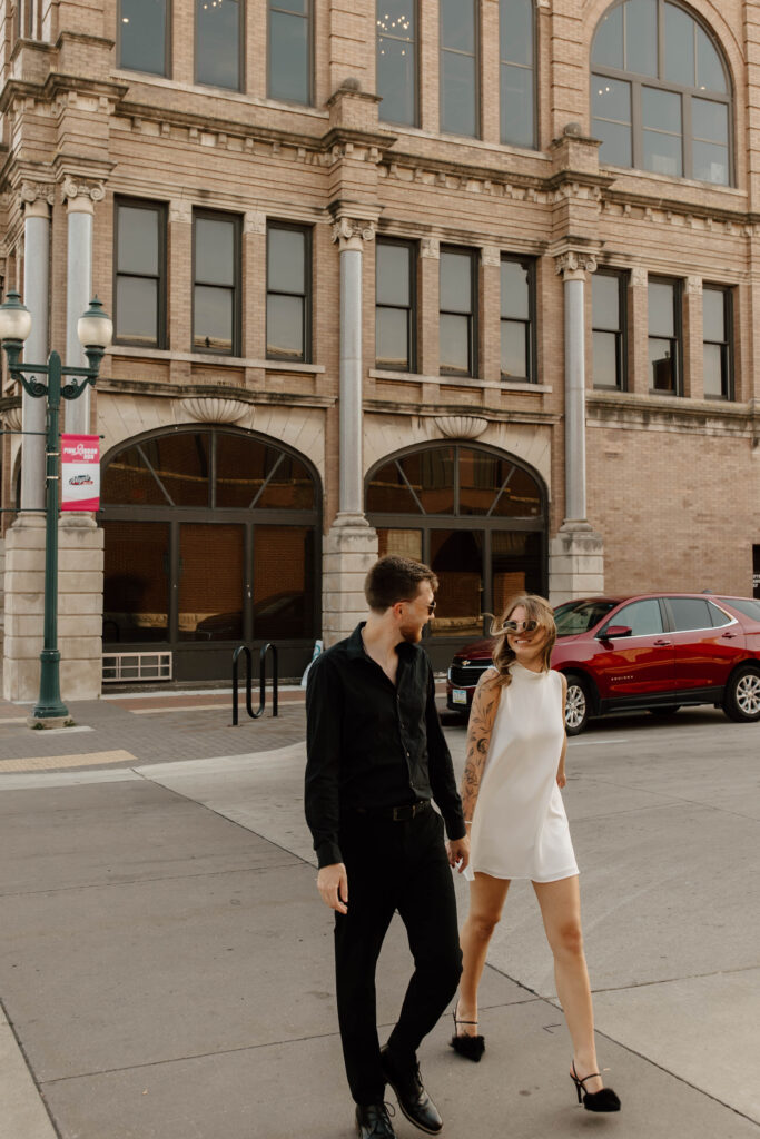 couple walks across street together