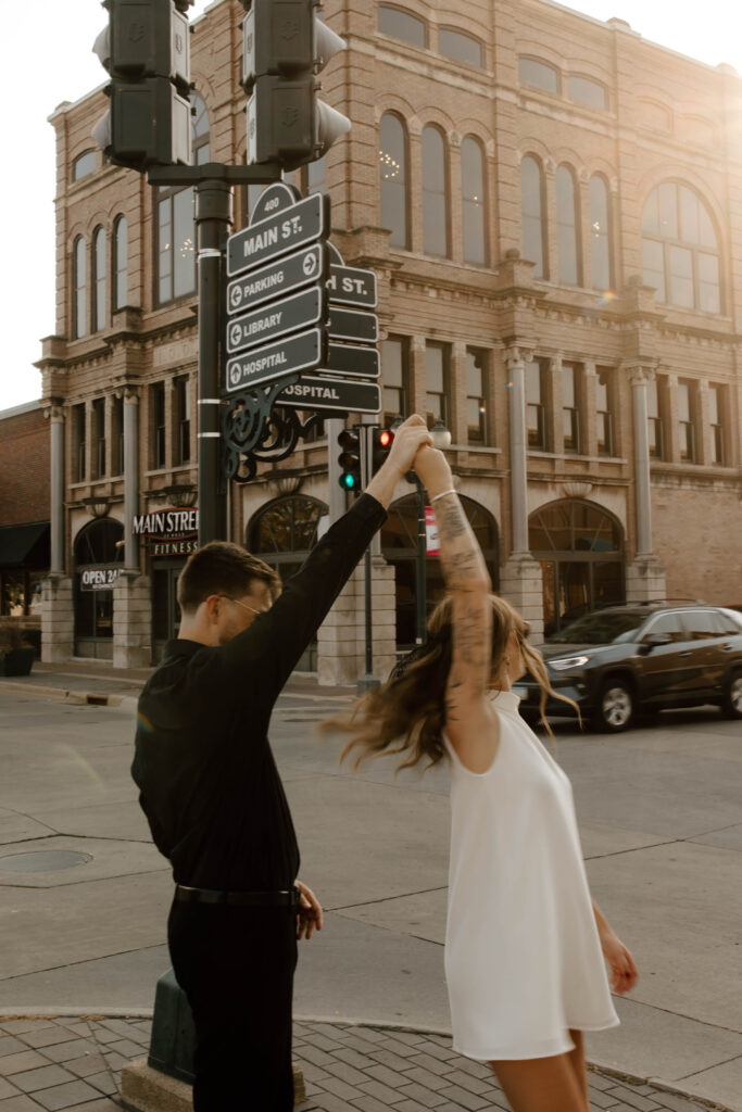 motion blurred photo of couple twirling downtown