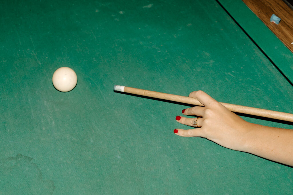 engagement ring on the pool table