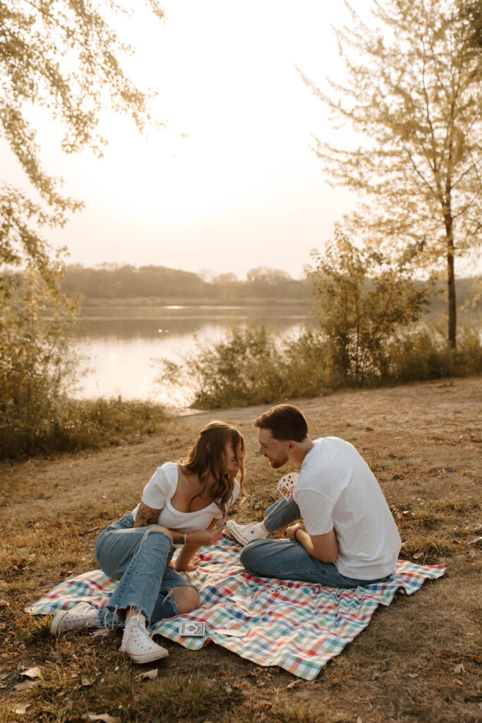 couple plays cards and leans together