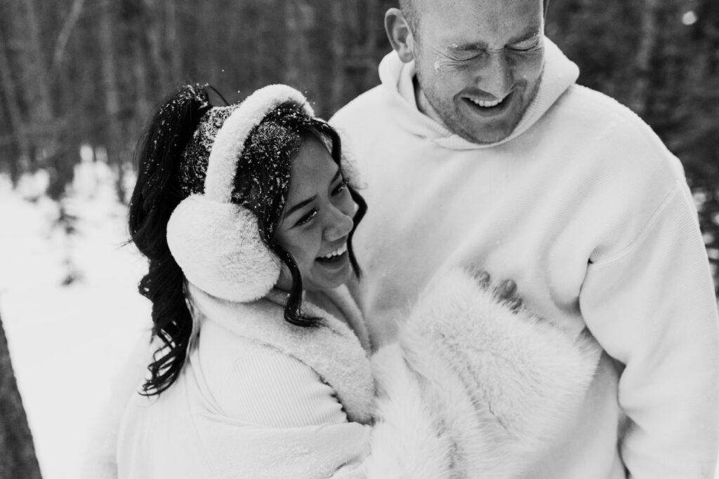 laughing together in the snow, Breckenridge colorado engagement photos