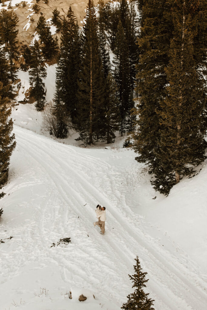 kissing in the snow, ethereal engagement photos