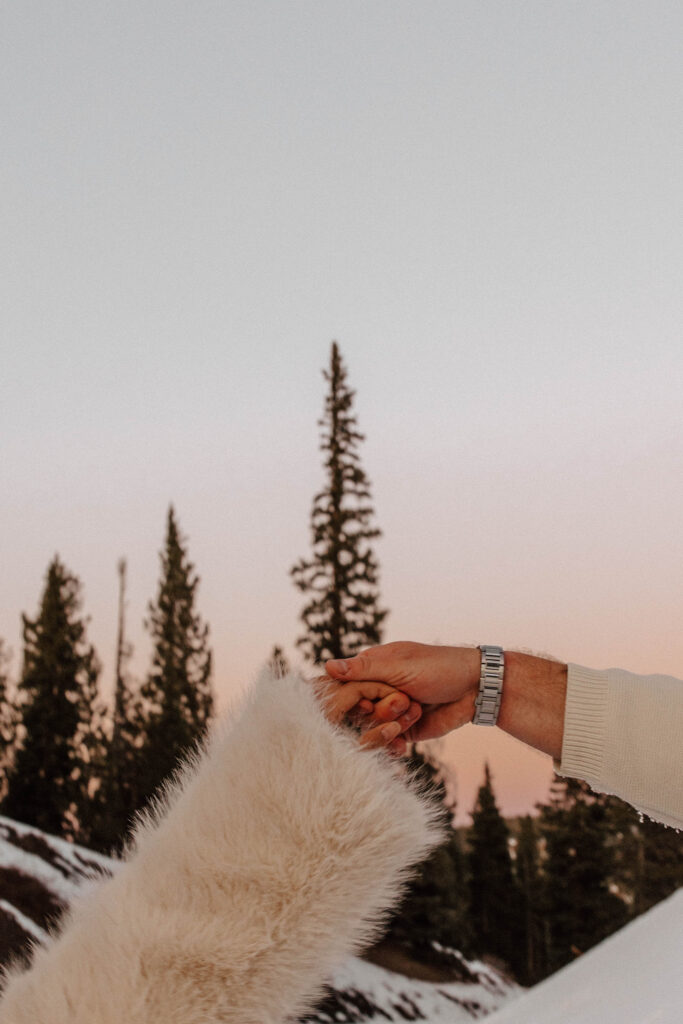 pink skies and snow engagement photos in the mountains