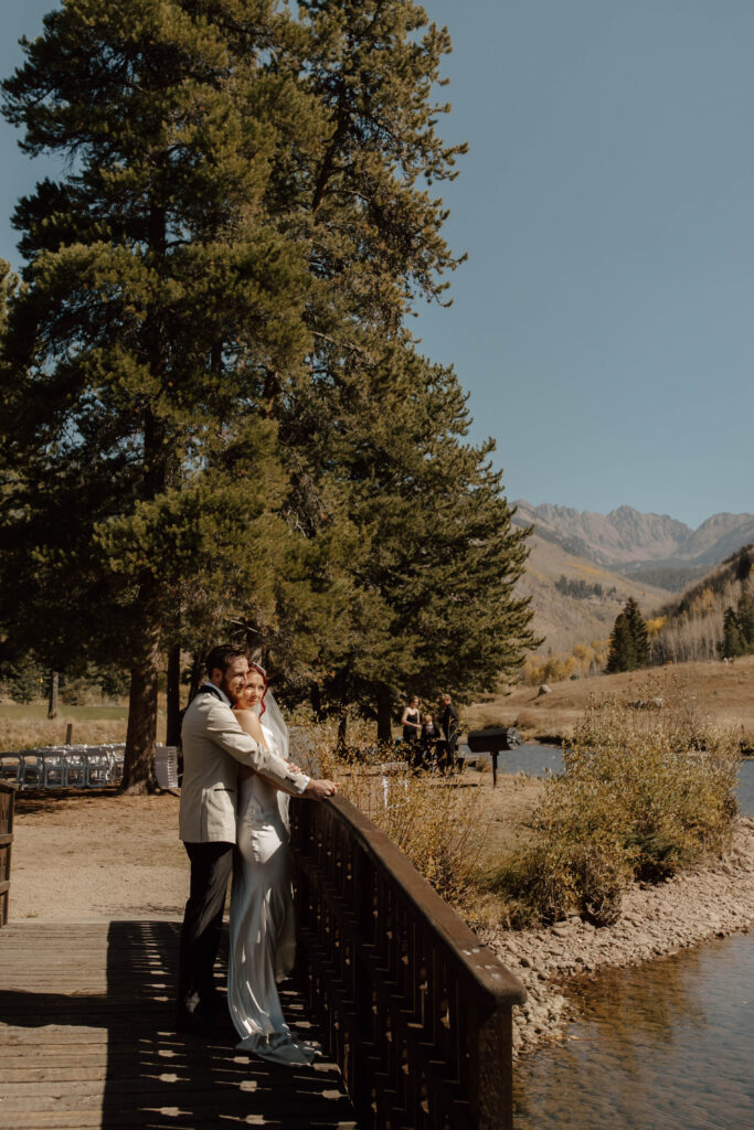 direct sunlight on couple in the mountains with aspens in the distance