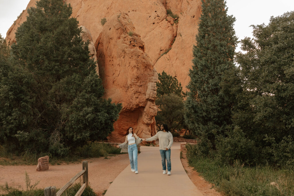 running together during engagement session In Colorado 