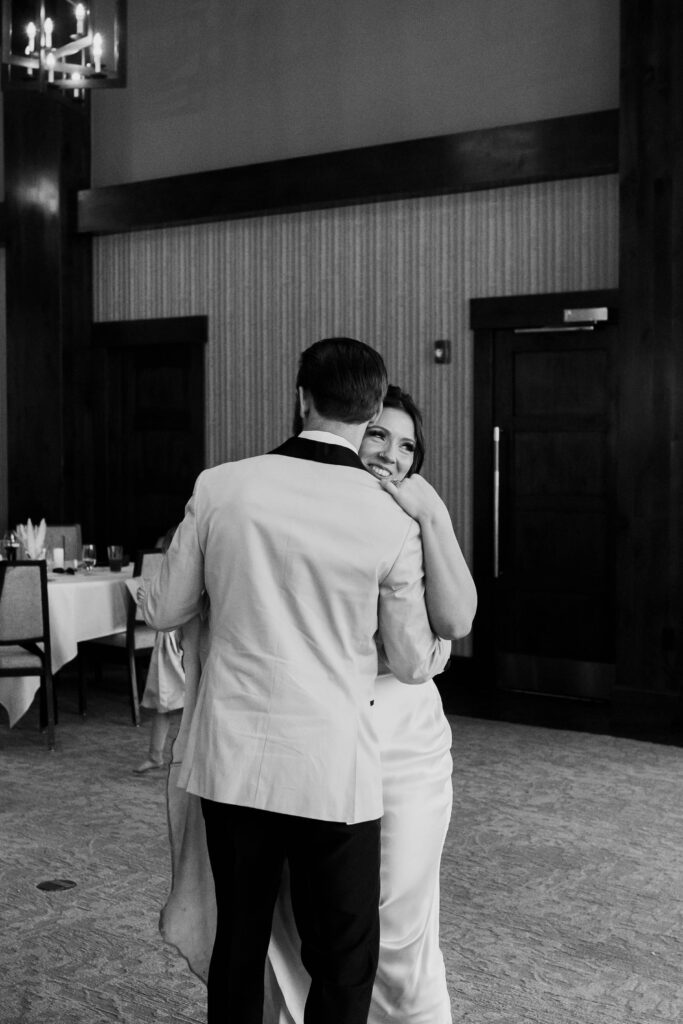 bride and groom dancing together at their wedding