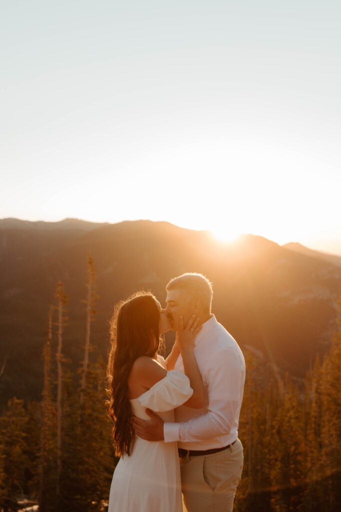 couple kisses during engagement photos