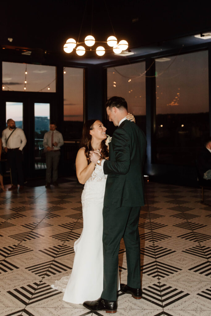 first dance at sunset in colorado with the mountains in the background