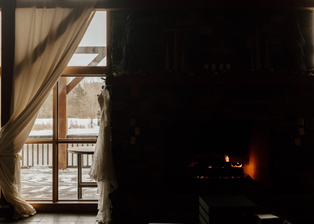 new york wedding in the snow, by the fireplace