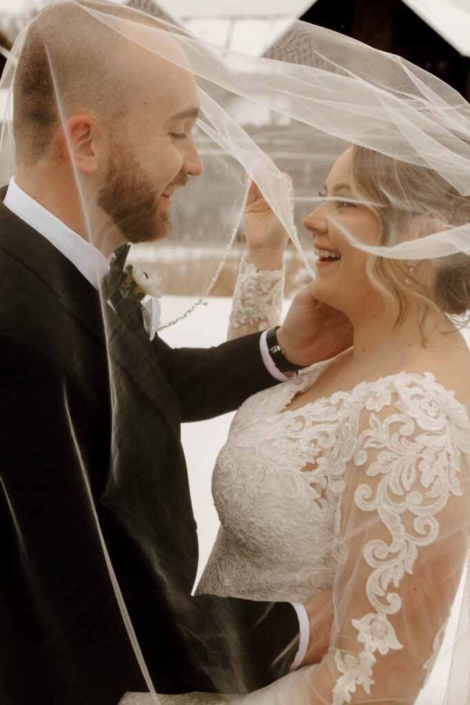 bride and groom under the veil