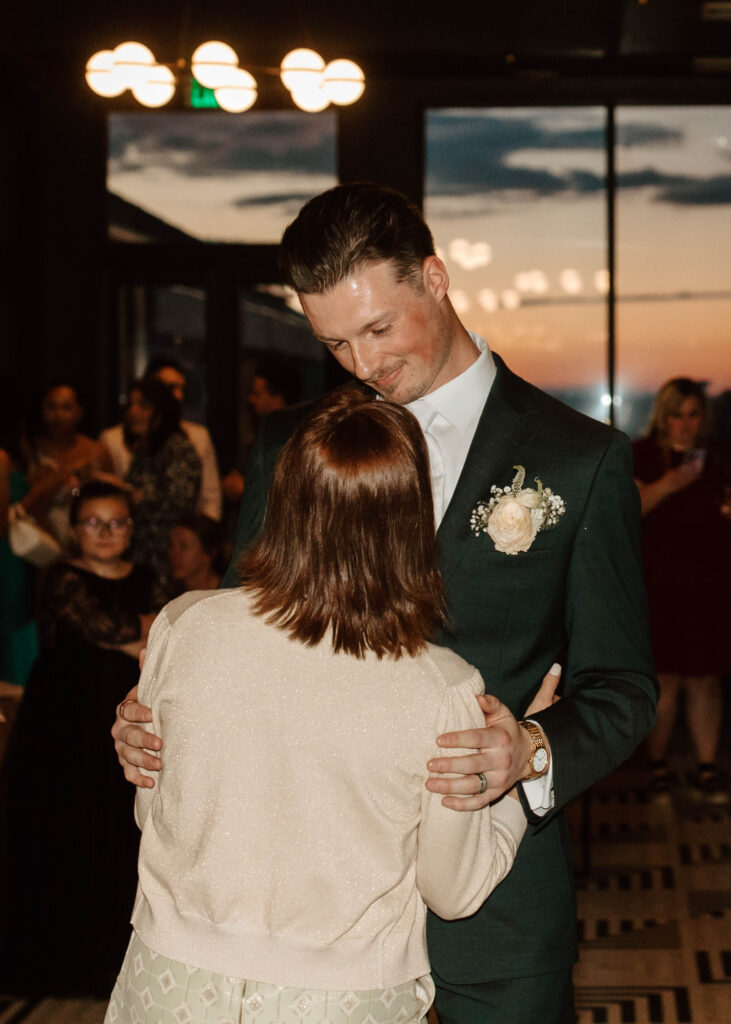 wedding dances in front of a mountain sunset