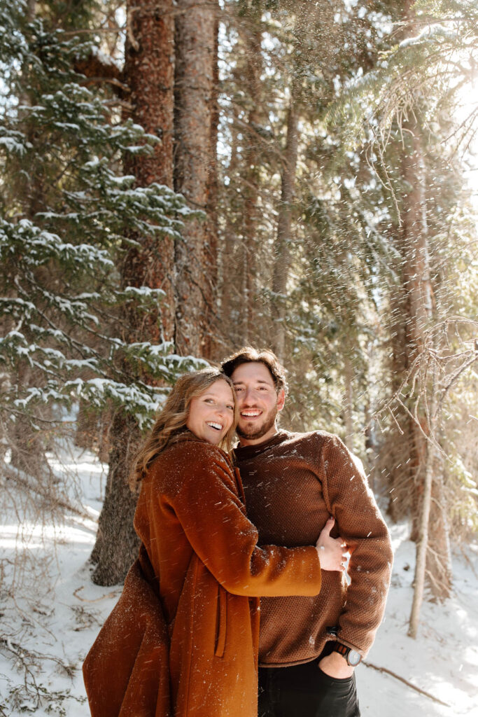 romantic engagement photos in the snow